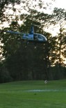 helicopter hovering over a special hole and pin after balls are dropped at the 6th Annual Family and Child Service of Schenectady Golf Ball Drop fundraiser - Schenectady NY - 16 Sep2011