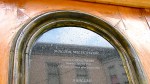 arch at top of window in a tombstone door at 109 S. Ferry St. in the Schenectady NY Stockade with the Walter Wilie Wish and Ballad –&nbsp;08Aug2011