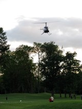 golf ball drop helicopter hovers at 9th hole