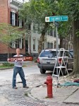 Beth Petta displaying Cucumber Alley Stockade Historic District Sign –&nbsp;10Sep09