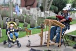 Larry Meyerhoff plays Celtic music to a young fan next to St. George’s Episcopal Church –&nbsp;12Sep09
