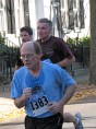 three men run up Front St. - Stockade-athon 2009
