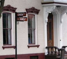 former Nights of Columusr building seen behind new Stockade Historic District signpost at S. Church and Union Sts. in Schenecady NY - 27May2010