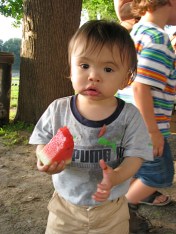 Andrew enjoying watermelon at the Riverside Park picnic - 21July2010