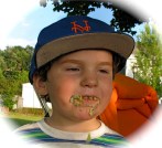 Devin wears his rainbow cupcake on his face at a RIverside Park picnic - 21July2010