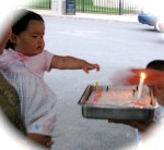 Xiwen points at her first birthday cake in Riverside Park –&nbsp;28July2010