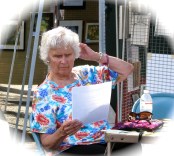 Lydia Eis concentrates at the Stockade disaster fund table - 60th Annual Stockade Villagers' Outdoor Art Show - 10Sep2011