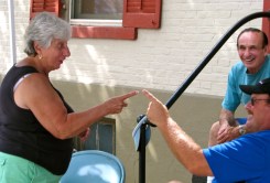 Stockade Outdoor Art Show organizers Connie Colangelo and Matt Volks stage some familial finger-pointing to the amusement of Marty Colangelo - 10Sept2011
