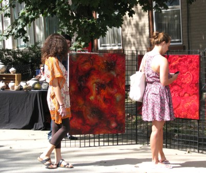 admirers view Nancy Magnell's exhibit on Front St. - 60th Annual Stockade Villagers' Outdoor Art Show - 10Sep2011