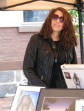 photographer Natalie Cartz at her exhibit on N. Ferry St. - 60th Annual Stockade Villagers' Outdoor Art Show - 10Sep2011
