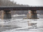scene showing piers of the CSX trestle over the Mohawk River looking east from Riverside Park in Schenectady NY about 9 am on 12Jan2014