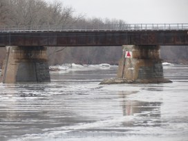scene showing piers of the CSX trestle over the Mohawk River looking east from Riverside Park in Schenectady NY about 9 am on 12Jan2014